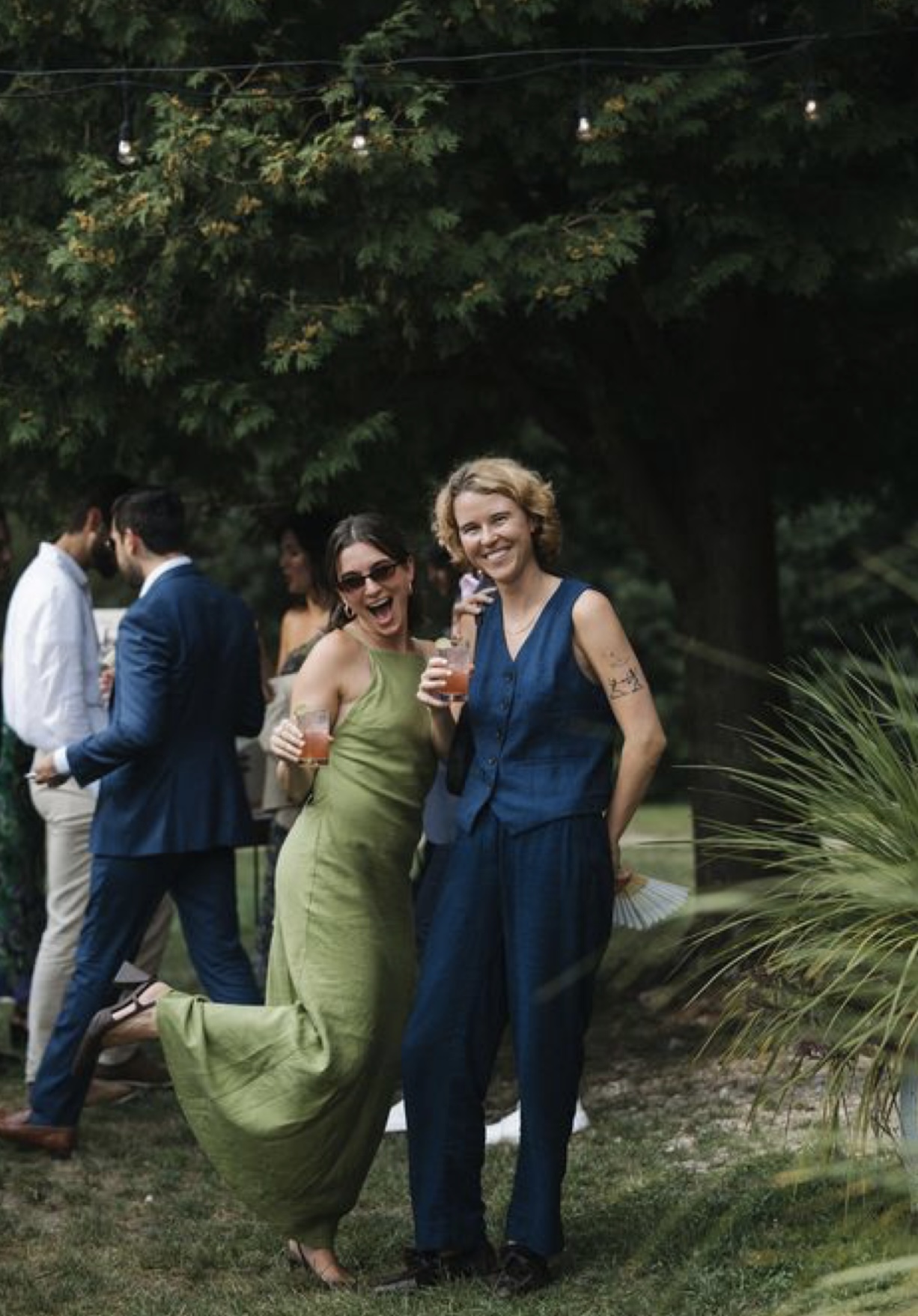 Wedding guests in colourful cocktail attire