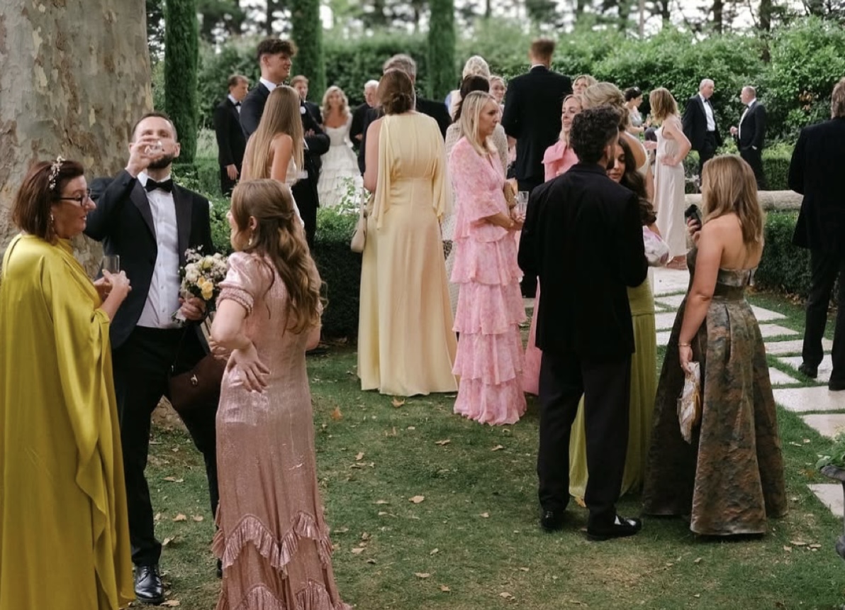 Wedding guests gathered outdoors