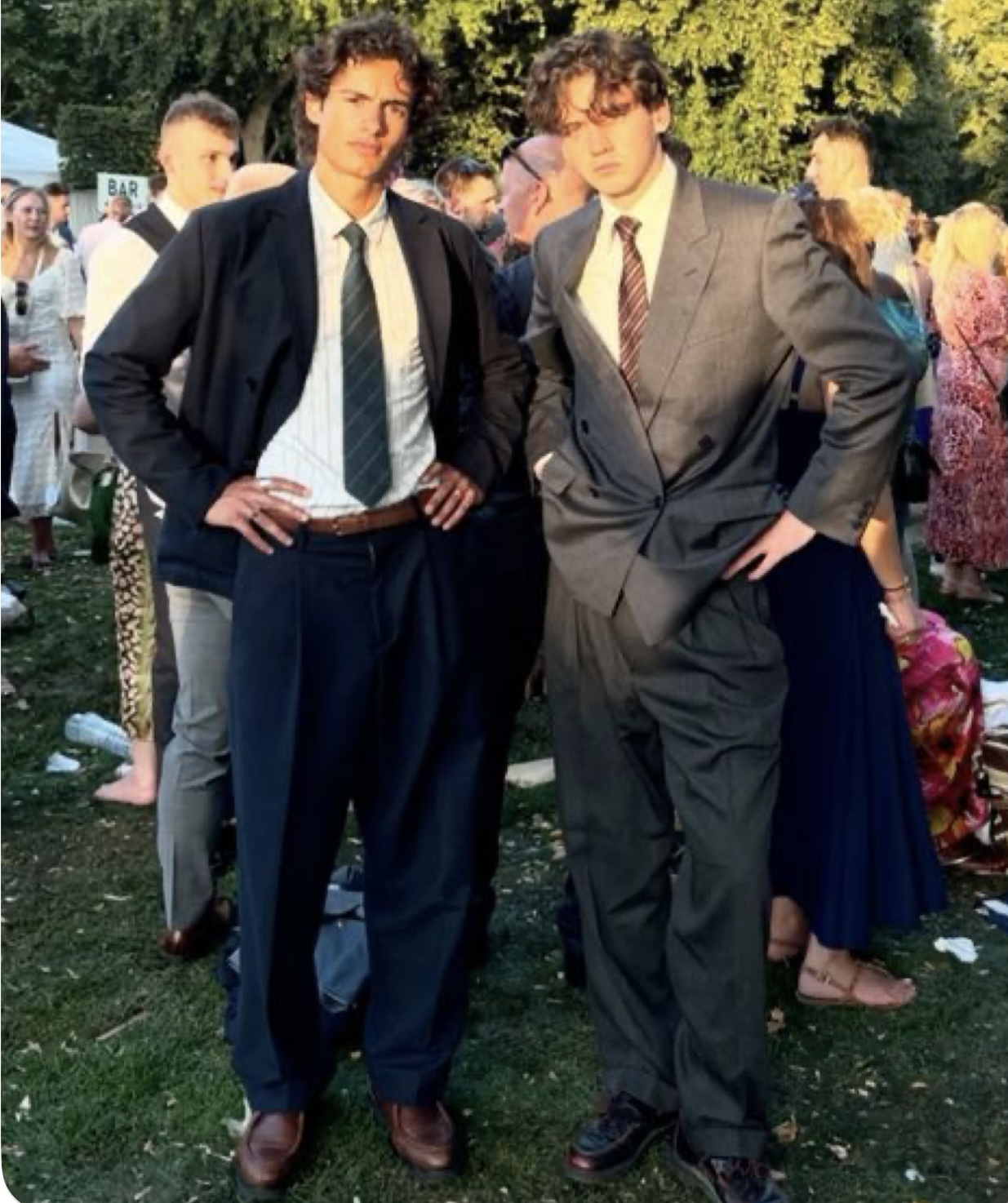 Guests in dark suits at the celebration