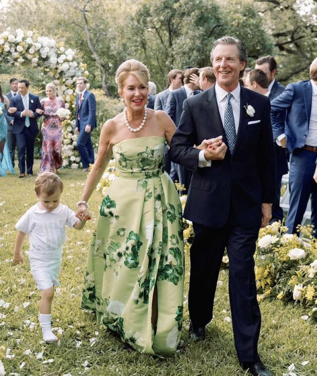 Guests arriving through a flower-lined garden
